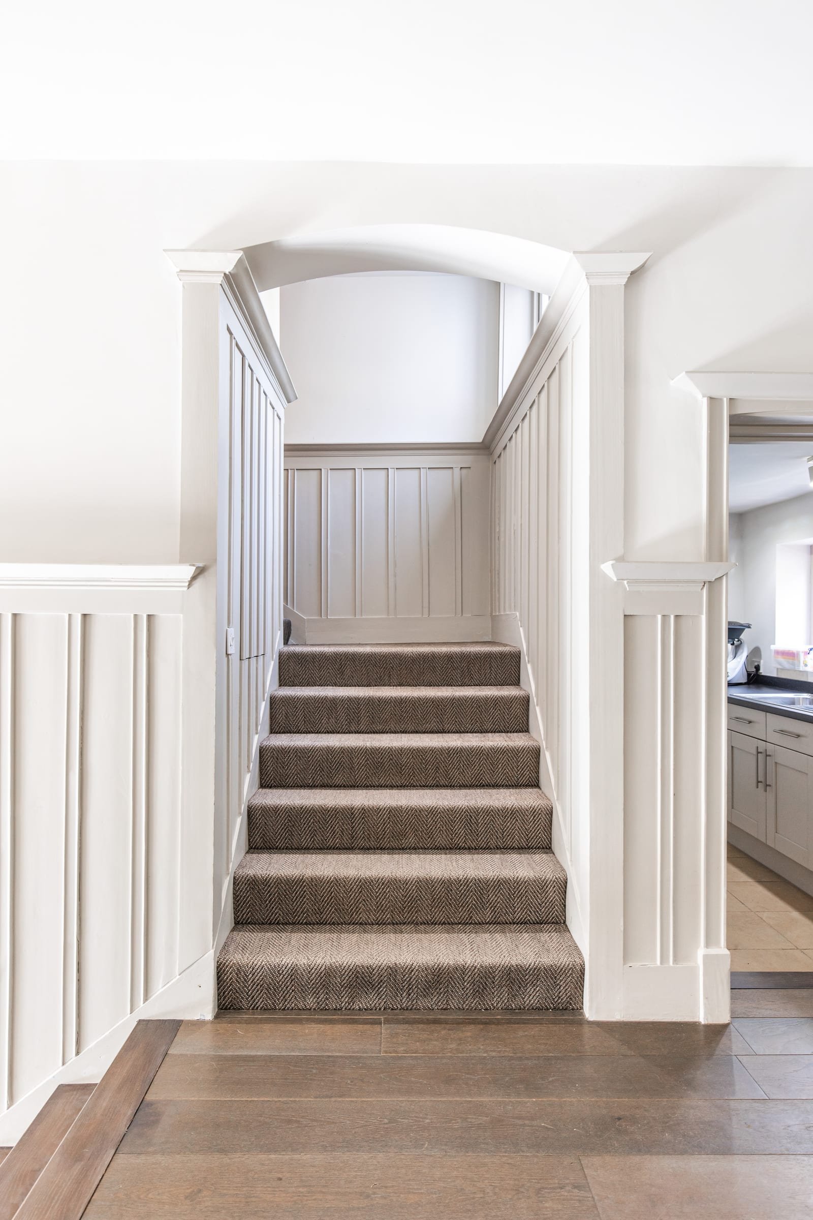 Original brick fireplace with wood-burning stove and panelled surround